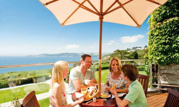 Carlyon Bay Hotel Family Eating Breakfast and Enjoying View from Balcony