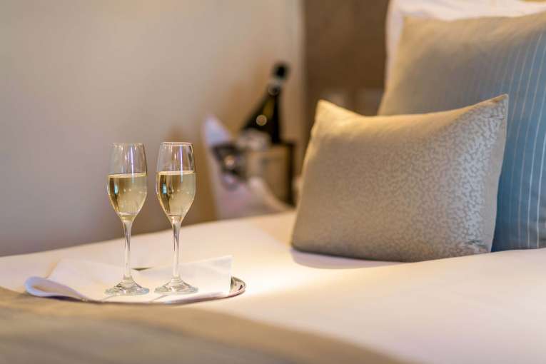 Carlyon Bay Hotel Champagne Flutes on Bed in Room