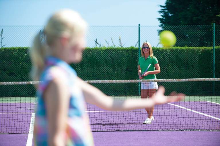 Mother daughter playing tennis Carlyon Bay 