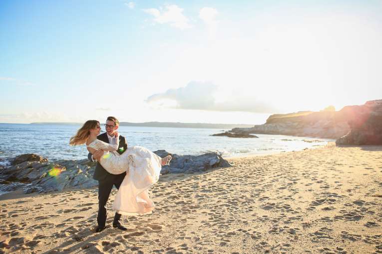 wedding couple on the beach at the carlyon bay