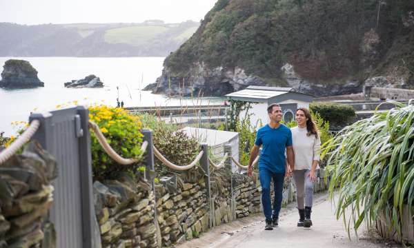 Couple walking in Charlestown near the Carlyon Bay Hotel