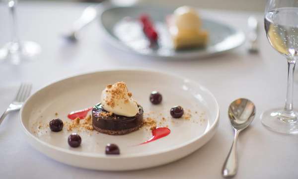 Dark Chocolate Ganache with Amaretto Cream and Cherry Syrup Dessert in the Bay View Restaurant, Carlyon Bay Hotel