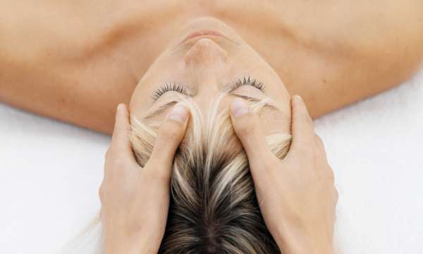 spa treatment woman having head massage