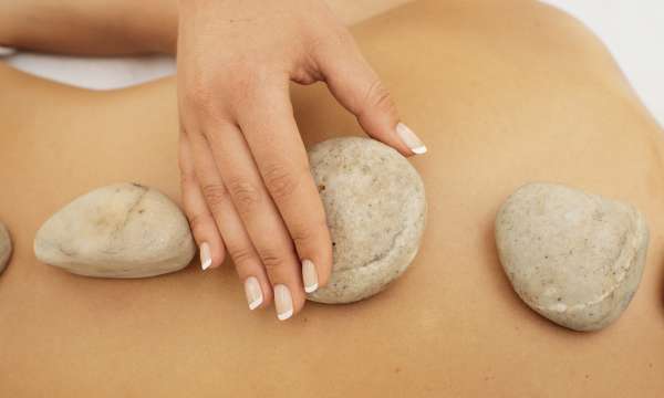 spa treatment stone massage on back