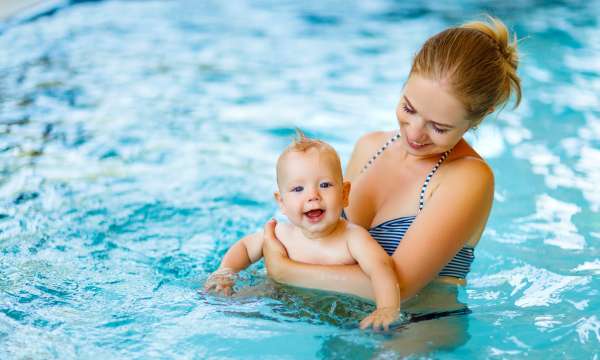 mother and baby in swimming pool