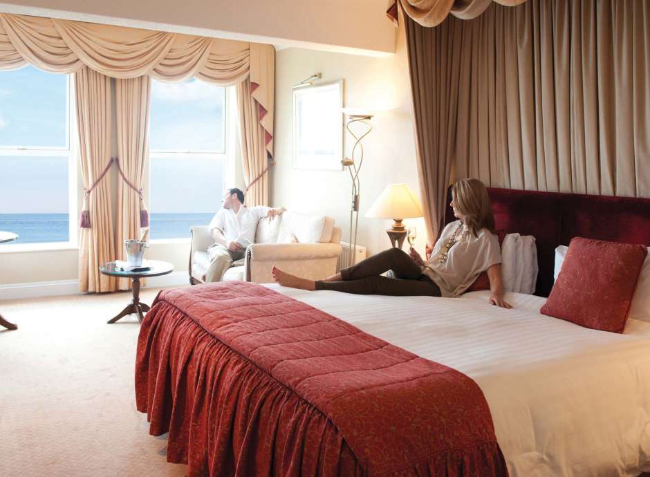 Carlyon Bay Hotel Couple Enjoying the View from the Window in their Room