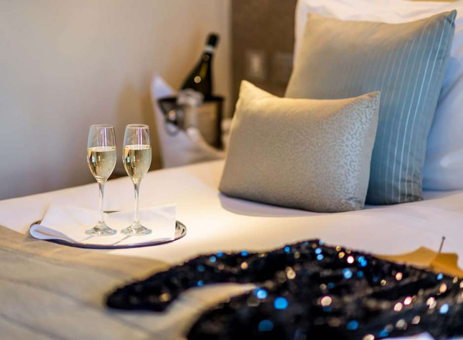 Carlyon Bay Hotel Christmas Party Outfit and Champagne Flutes on Bed