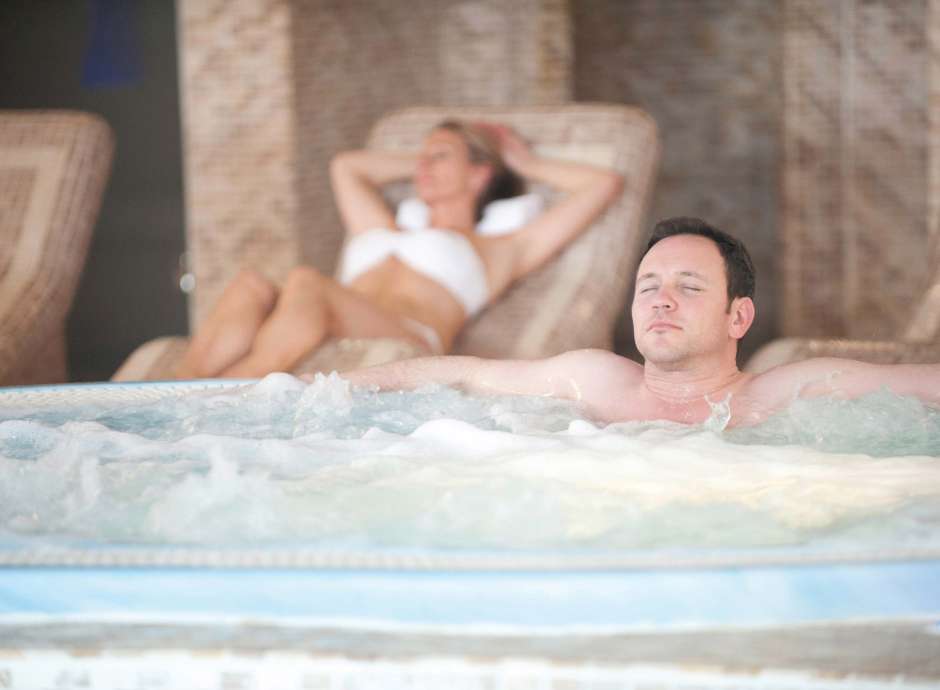 Carlyon Bay Hotel Guest Relaxing in Jacuzzi Spa Hot Tub