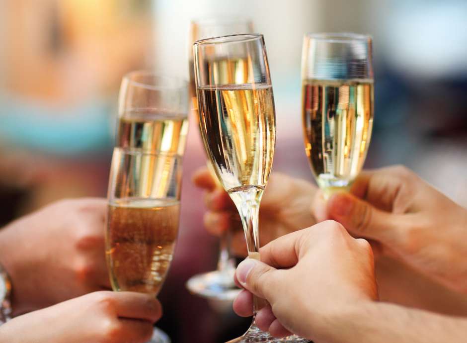 Wedding guests making a toast with champagne