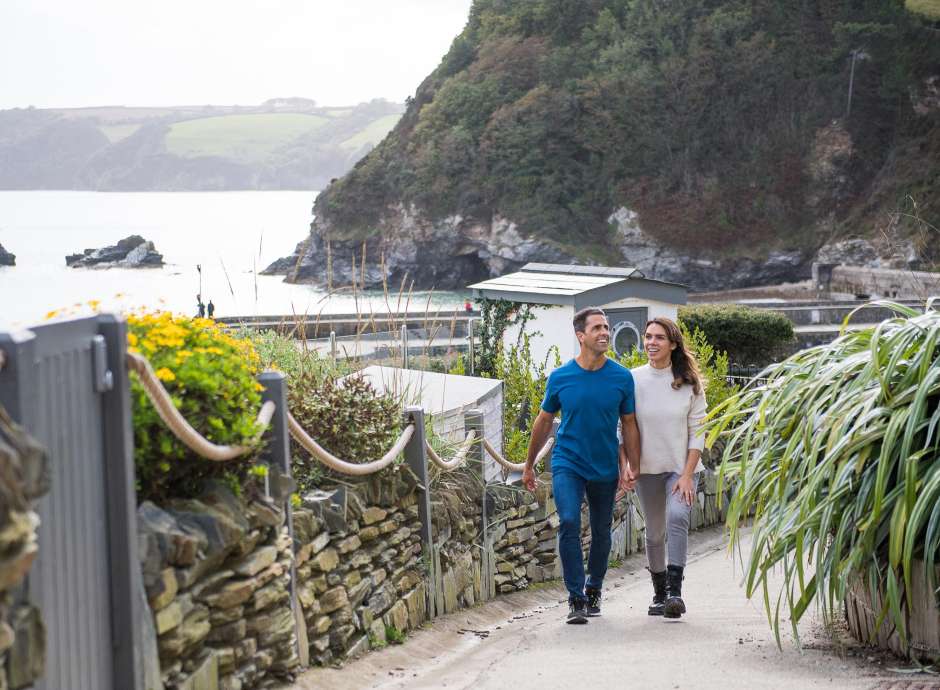 Couple walking in Charlestown near the Carlyon Bay Hotel