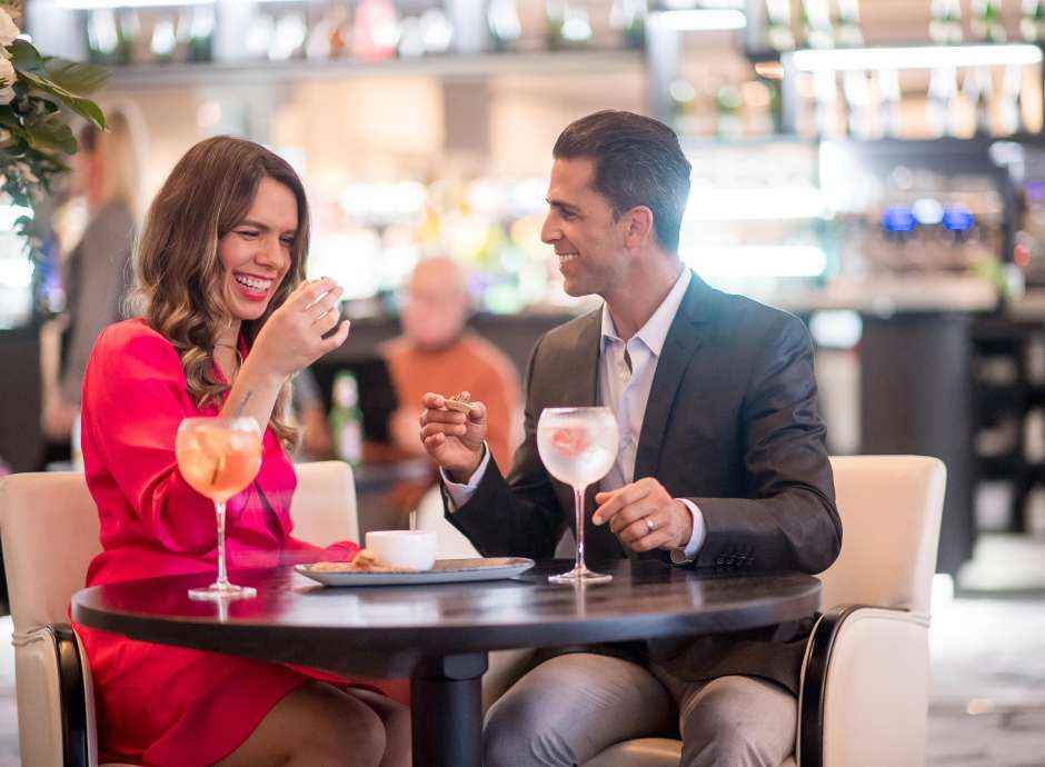 Couple drinking Cocktails in the Terrace Lounge Bar at the Carlyon Bay Hotel