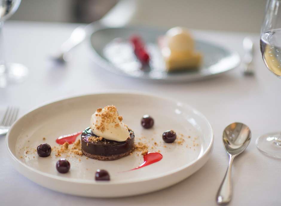 Dark Chocolate Ganache with Amaretto Cream and Cherry Syrup Dessert in the Bay View Restaurant, Carlyon Bay Hotel