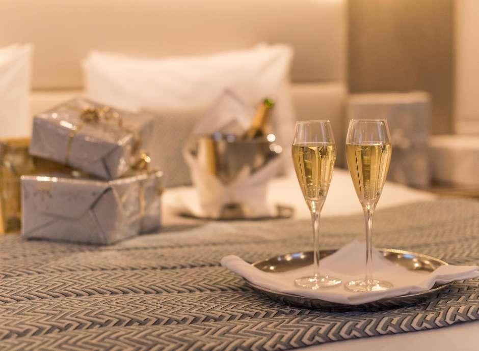 Champagne and Christmas Presents on a bed in the Carlyon Bay Hotel