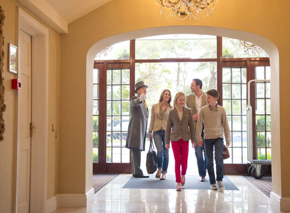 Family entering hotel foyer