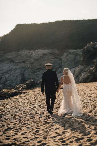 Bride and Groom Walking on the Sand