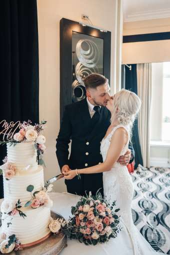Bride and Groom Cutting the Cake