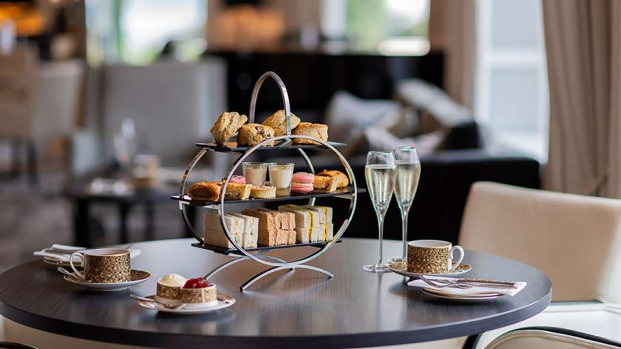Afternoon Tea with a pot of tea and glass of prosecco