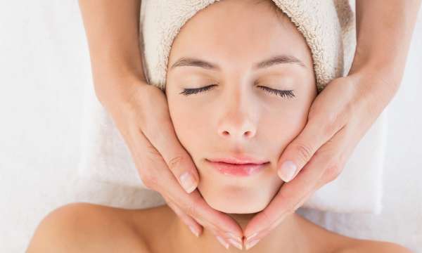 woman in spa having treatment facial