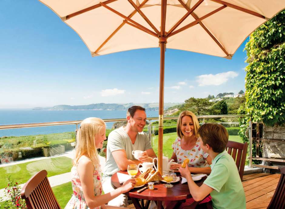 Carlyon Bay Hotel Family Eating Breakfast and Enjoying View from Balcony